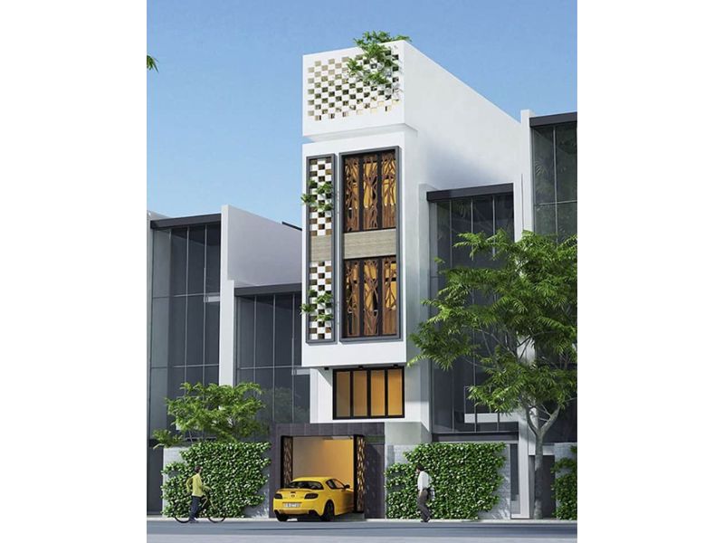 Mặt tiền nhà 5x15m có thang máy sử dụng vật liệu kính hiện đại và hệ lam chắn tinh tế mang đến không gian sống tiện nghi