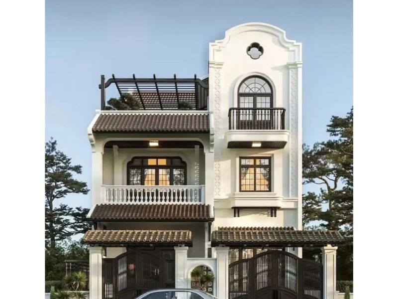 Mẫu nhà phố 2 tầng indochine đặc trưng với hệ cửa vòm, sảnh hiên rộng 