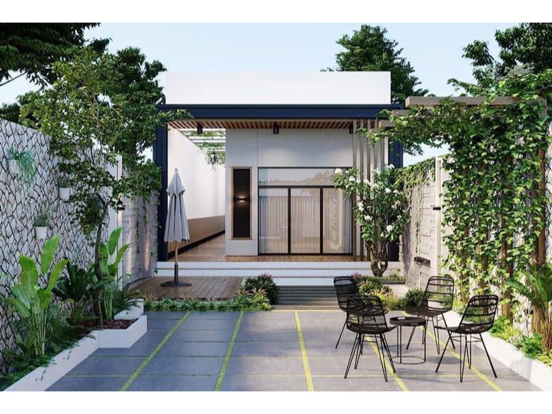 Tiểu cảnh sân vườn xanh mát, thư giãn của thiết kế nhà cấp 4 kết hợp kinh doanh