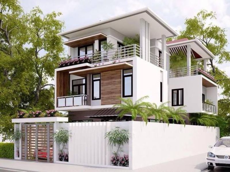 Ngoại thất nhà 4 tầng ngang 10m nổi bật với các hình khối đua rộng kết hợp mảng xanh linh hoạt